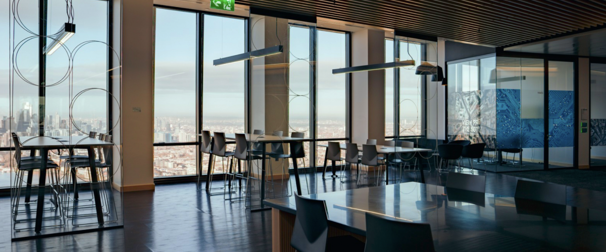 Commuters walk through Reuters Plaza, Canary Wharf